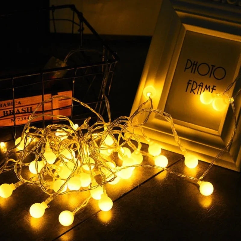 Warm white globe string lights shown as cozy room decor